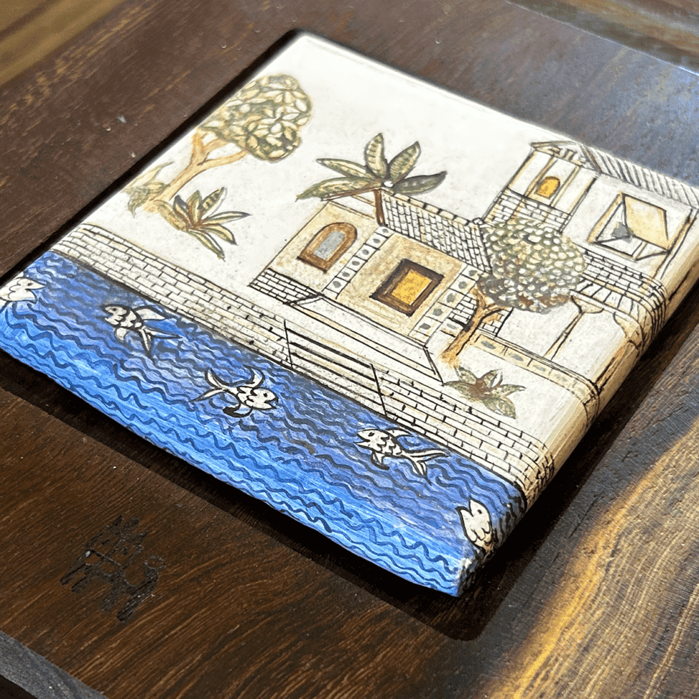 Kutch Kamangiri panel artwork depicting landscape and water scene with trees and buildings.
