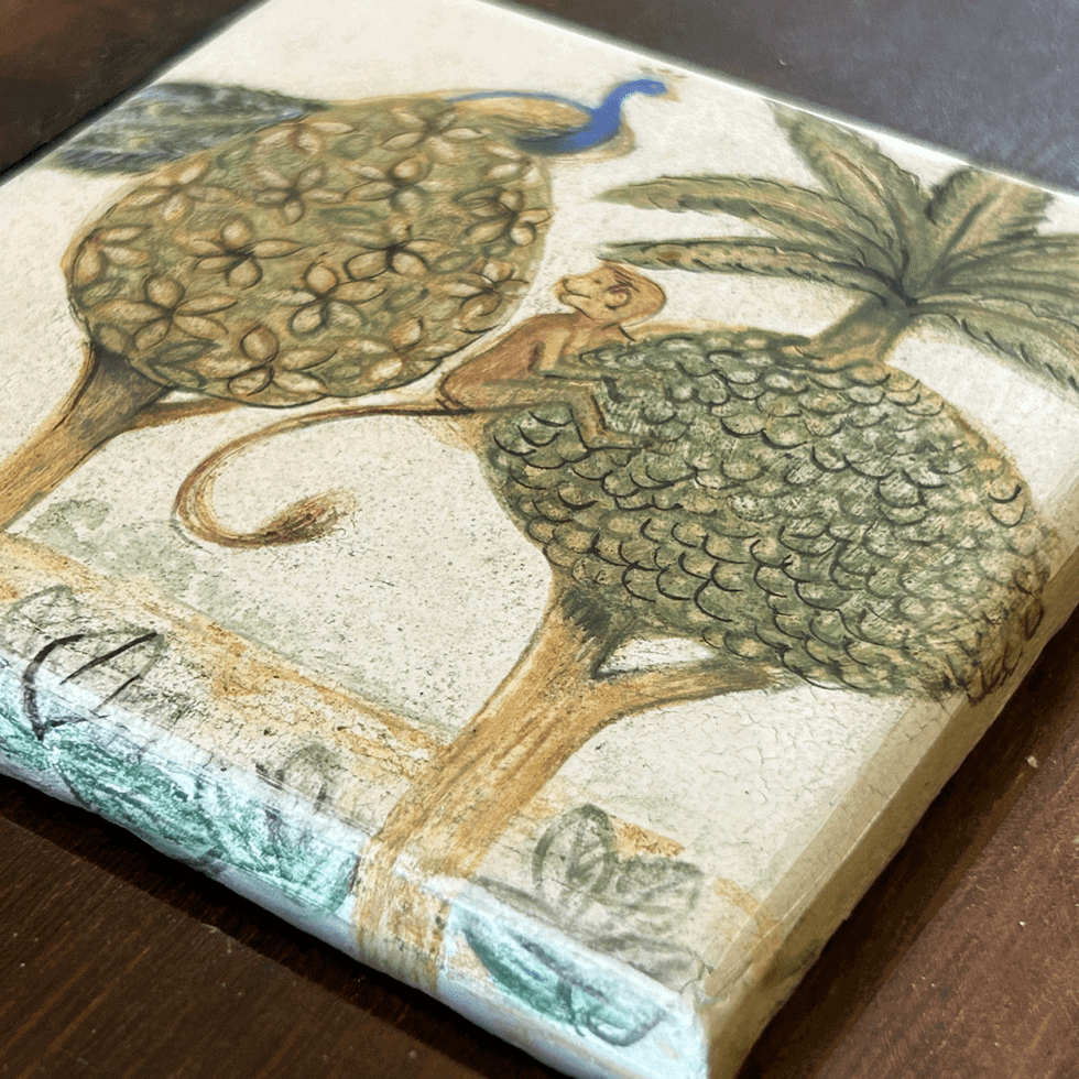 Traditional Kutch artwork featuring trees, a peacock, and a lion in earthy tones.