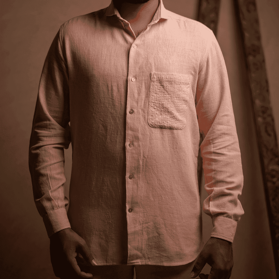 Men's pastel pink linen shirt with a front pocket, casual style.